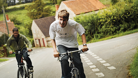 man-observing-stoma-pouch-on-his-abdomen-thinking-about-body-image-concerns-with-a-stoma